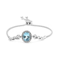 Load image into Gallery viewer, .925 Sterling Silver 10x8mm Oval Blue Topaz and Diamond Accent Lariat 4”-10” Adjustable Bolo Bracelet (H-I Color, SI1-SI2 Clarity)
