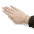 Load image into Gallery viewer, 14K Yellow Gold Alternating Bezel Set 5MM Oval Shaped Tanzanite and 1/5 Cttw Diamond Bangle Bracelet (H-I Color, VS2-SI1 Clarity) - Fit's wrists up to 7.25" Inches
