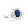Load image into Gallery viewer, 18K White Gold 7x5 mm Oval Cut Blue Sapphire and Round Diamond 3/4 Cttw Sunburst Halo Ring (F-G Color, VS1-VS2 Clarity)
