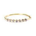 Load image into Gallery viewer, 14K Yellow Gold Alternating Bezel Set 5MM Oval Shaped Tanzanite and 1/5 Cttw Diamond Bangle Bracelet (H-I Color, VS2-SI1 Clarity) - Fit's wrists up to 7.25" Inches
